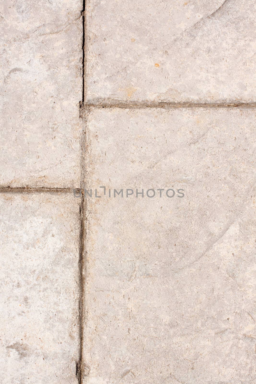 A stone checkerboard background texture detail from a sidewalk.