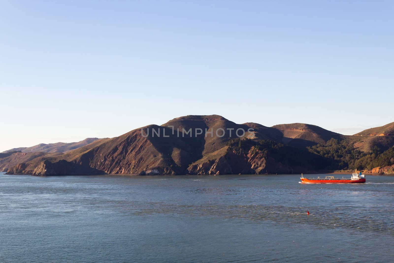 Cargo Ship near the coastline by bigjohn36