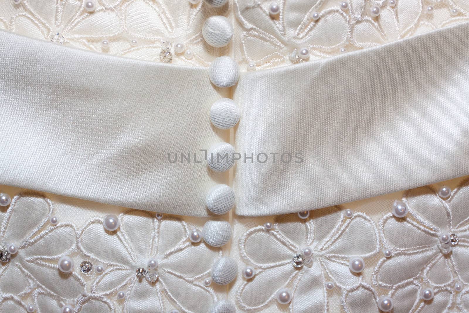 A detail image of a wedding dress before the marriage ceremony.