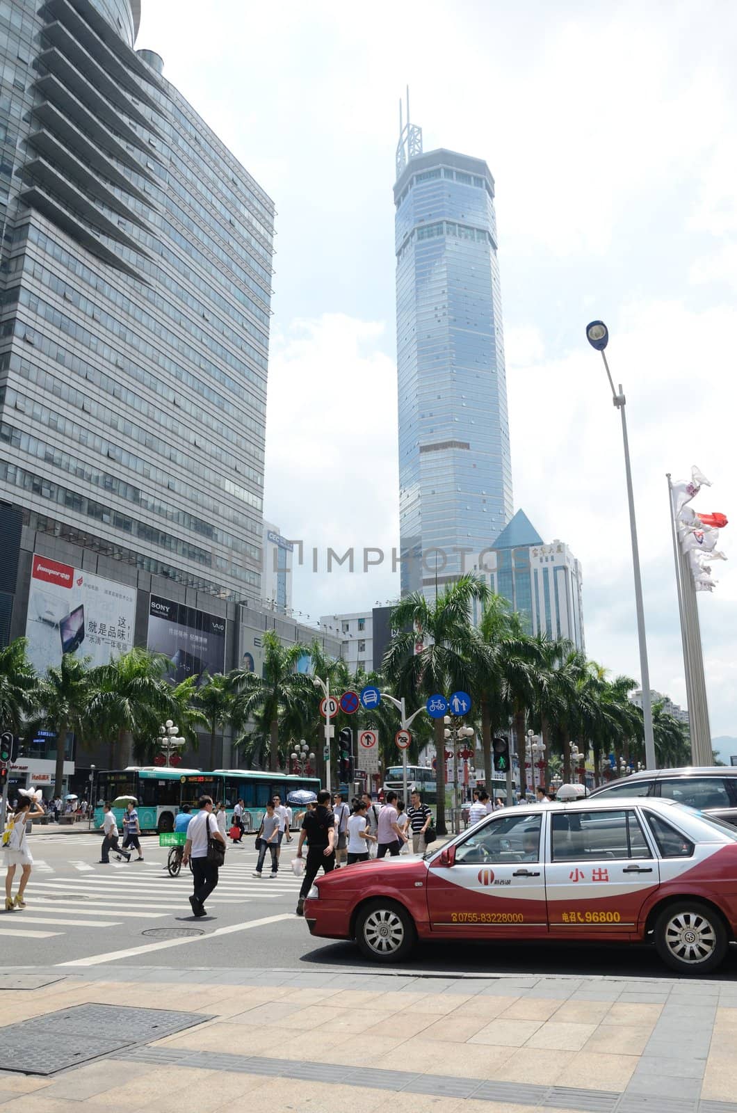 SHENZHEN, CHINA - SEPTEMBER 6: Unidentified group of people walk along HuaQiang Lu - famous shopping street in Shenzhen on September 6, 2012.