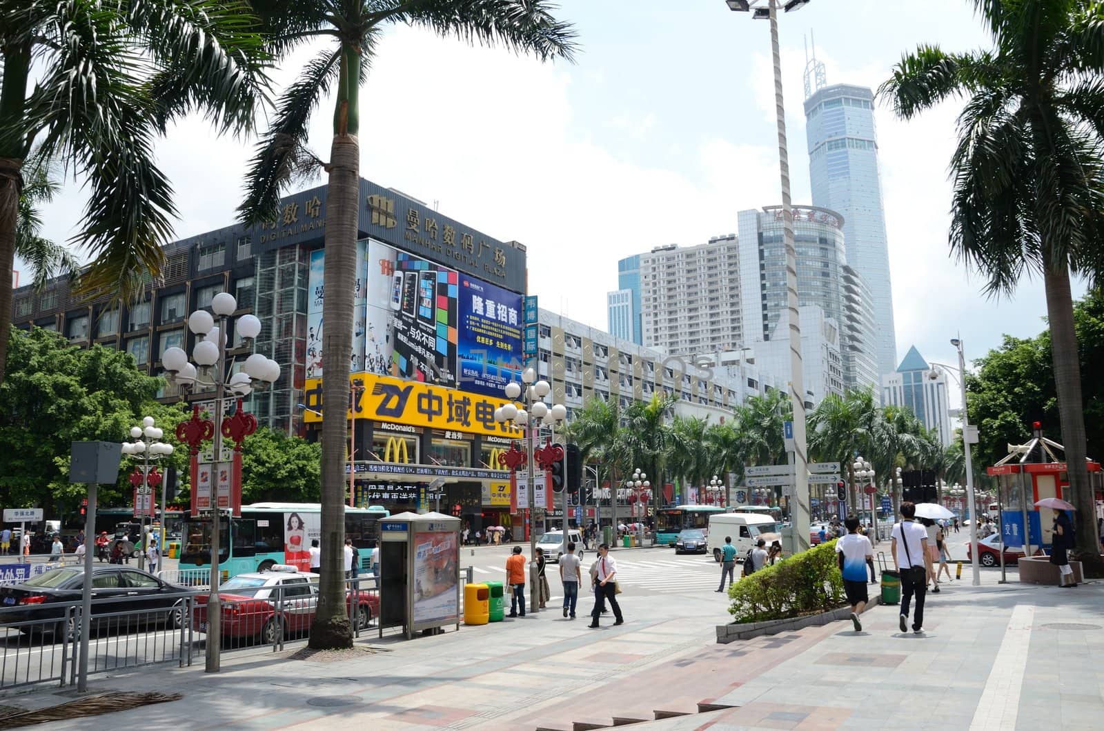 SHENZHEN, CHINA - SEPTEMBER 6: Unidentified group of people walk along HuaQiang Lu - famous shopping street in Shenzhen on September 6, 2012.