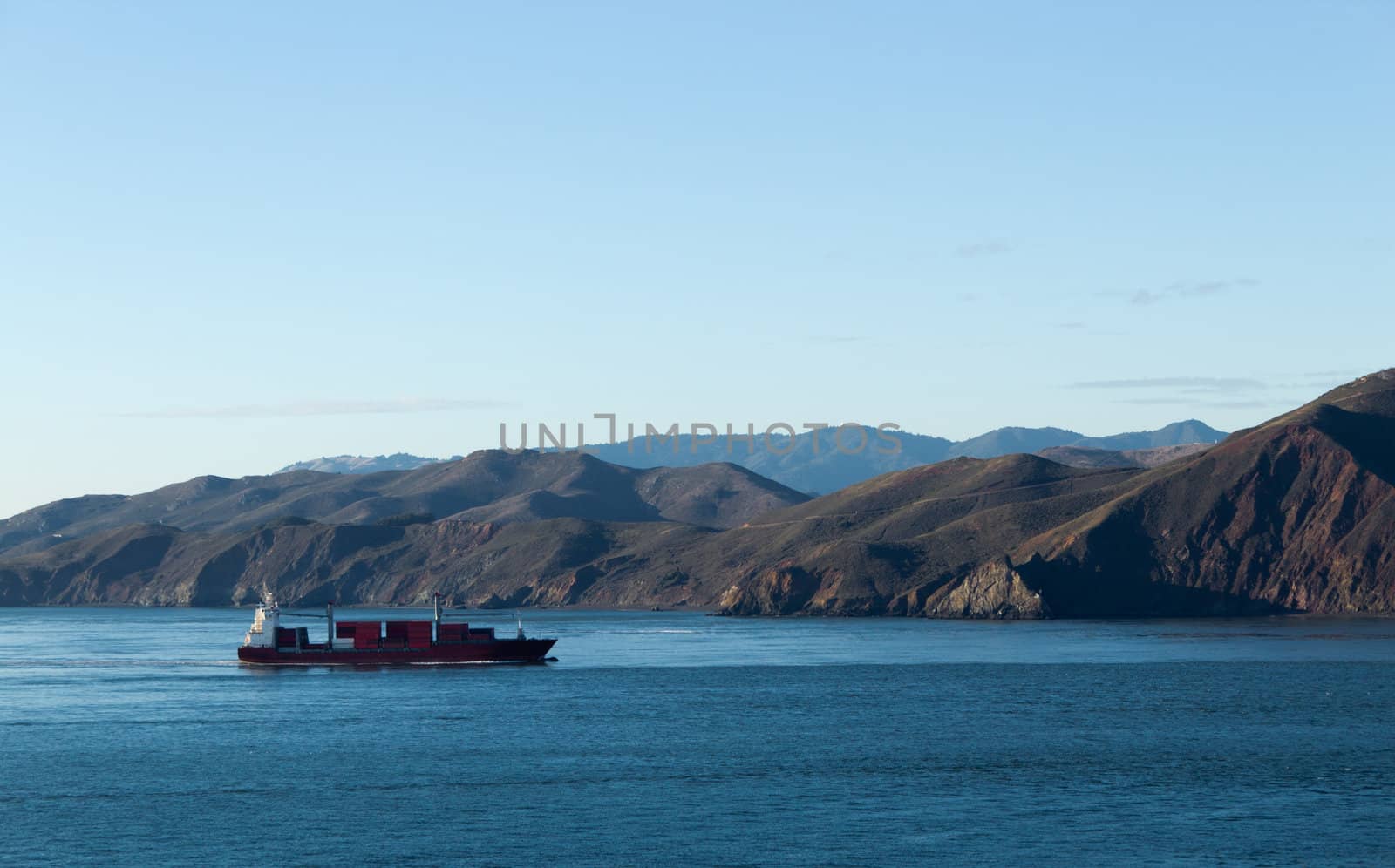 Cargo Ship near the coastline by bigjohn36