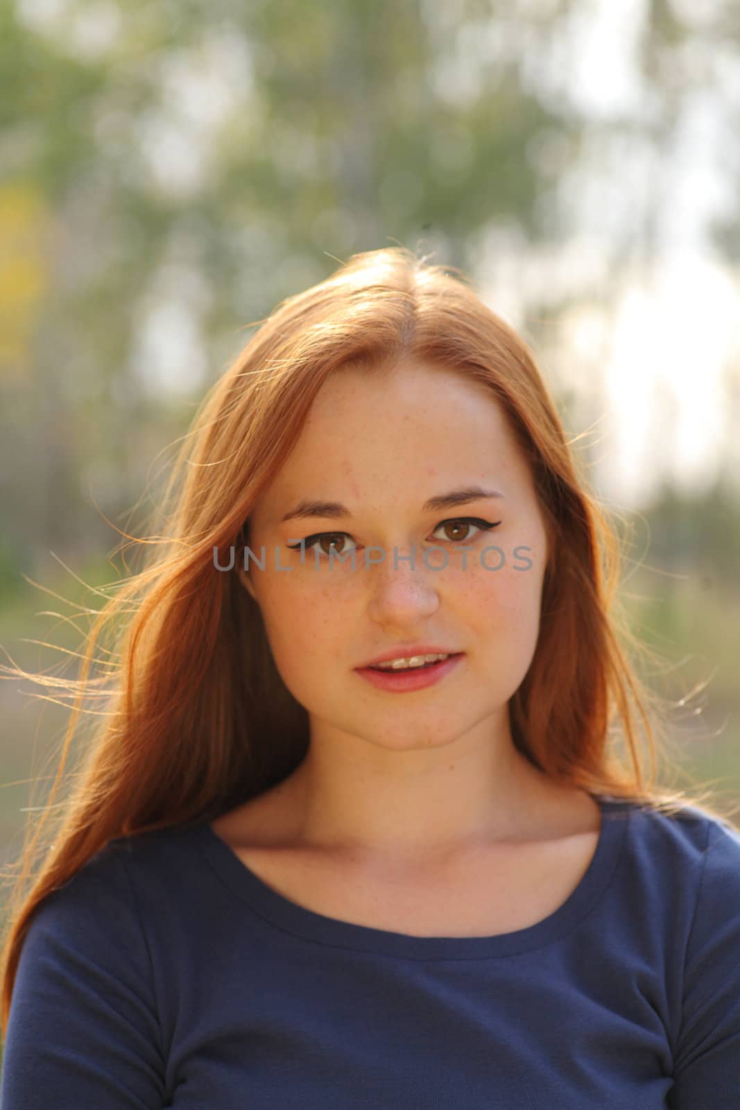 portrait of cute red haired young woman, outdoor