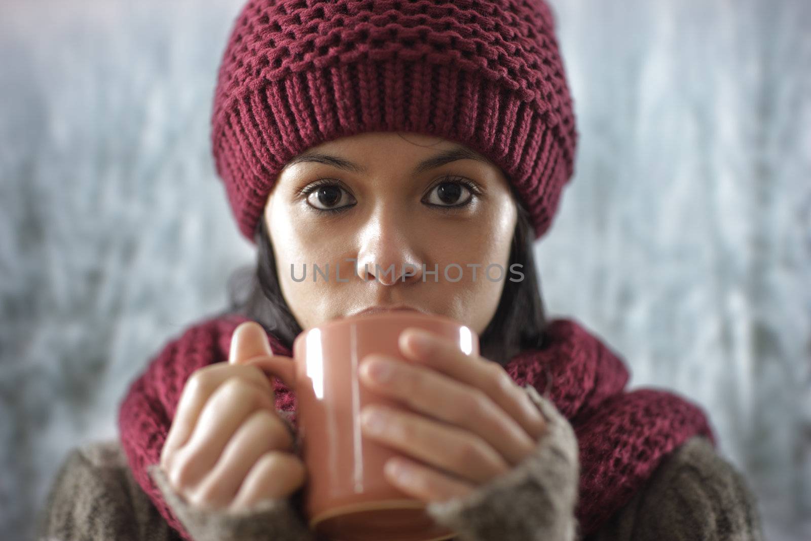 Portrait of beautiful girl drinking a hot drink