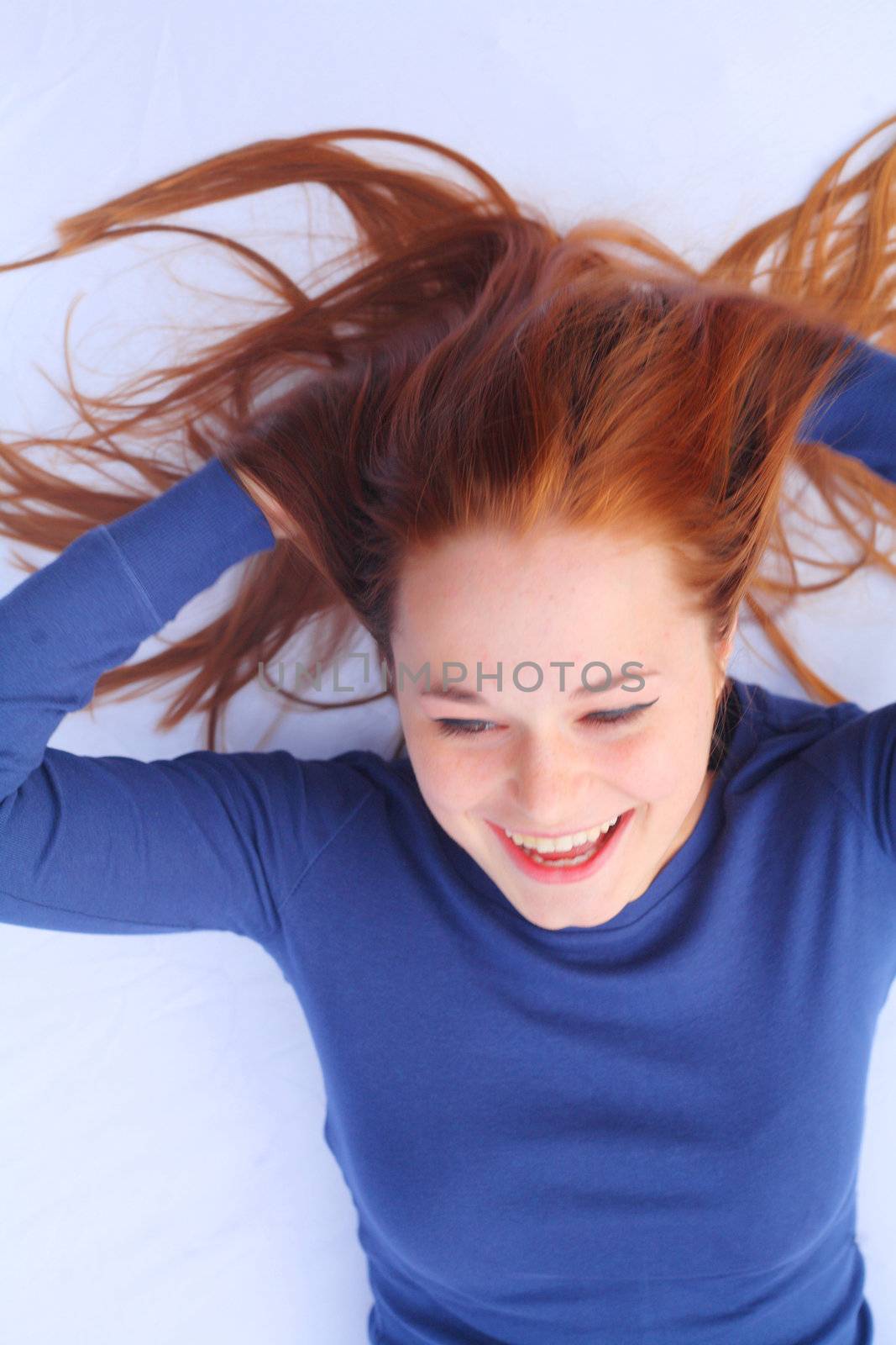 portrait of a woman with beautiful long red healthy shiny hair
