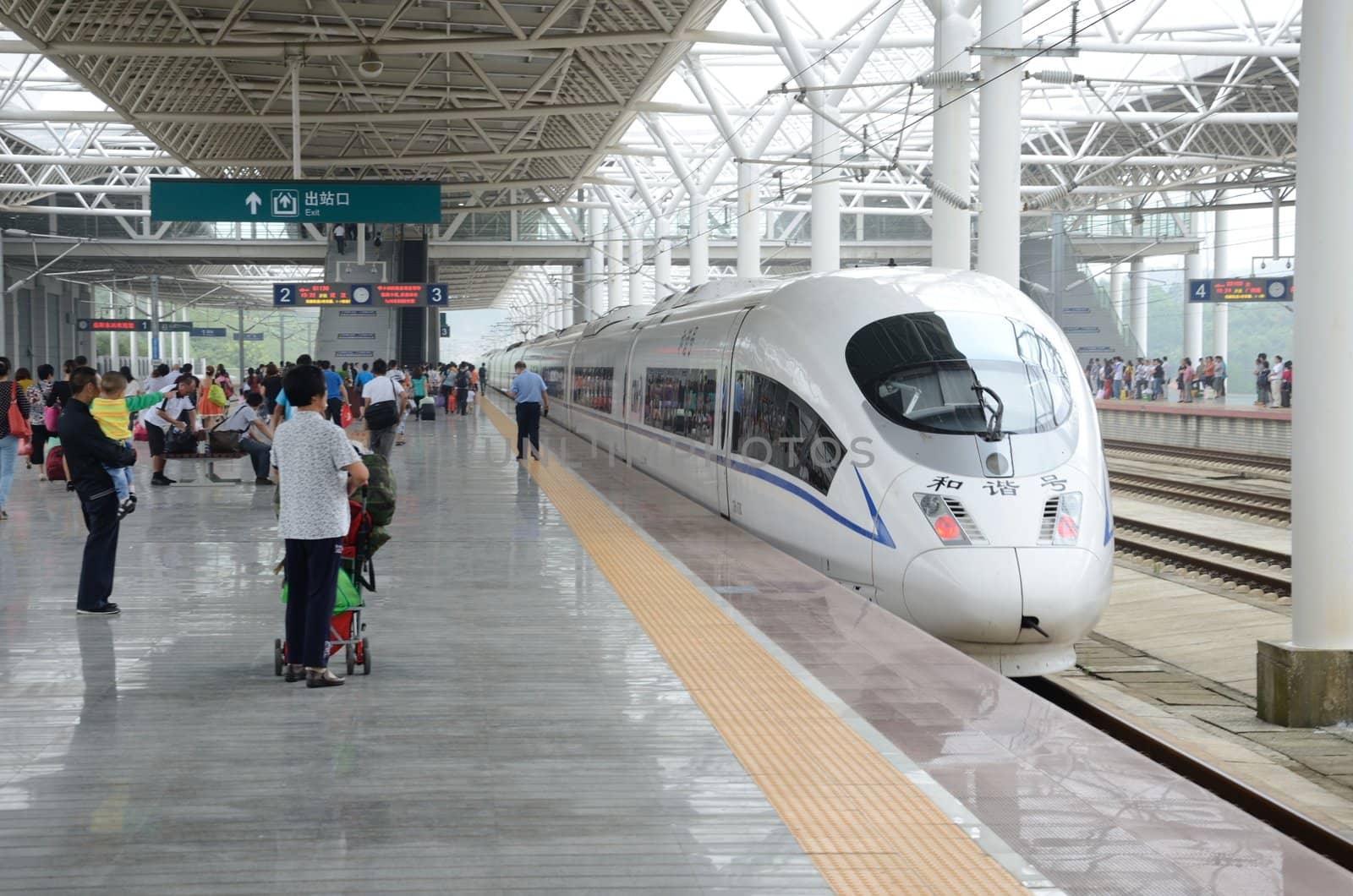 YUEYANG, CHINA - SEPTEMBER 9:  Unidentified passangers wait in YueYang railway station on September 9, 2012. Fast train takes them to Wuhan within one hour.