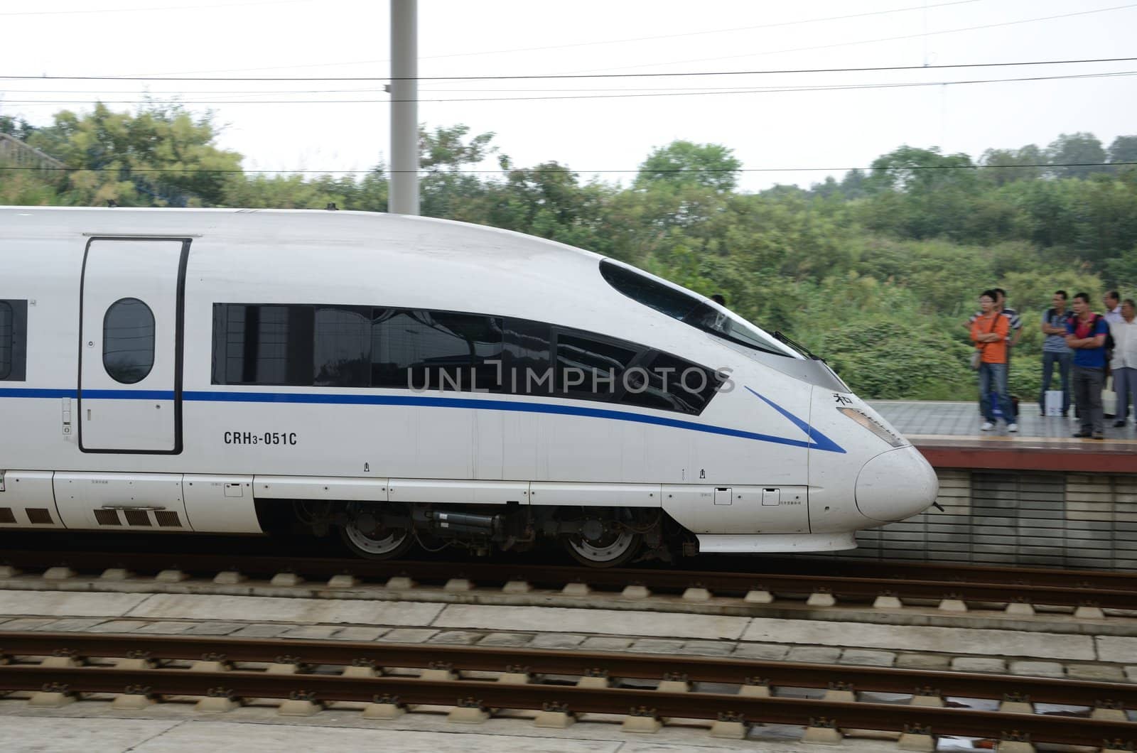 YUEYANG, CHINA - SEPTEMBER 9:  Fast train between Shenzhen and Wuhan stops in YueYang railway station on September 9, 2012. 