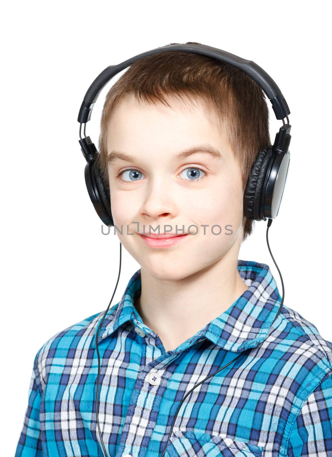 Portrait of 10 years boy wearing headphones over a white background