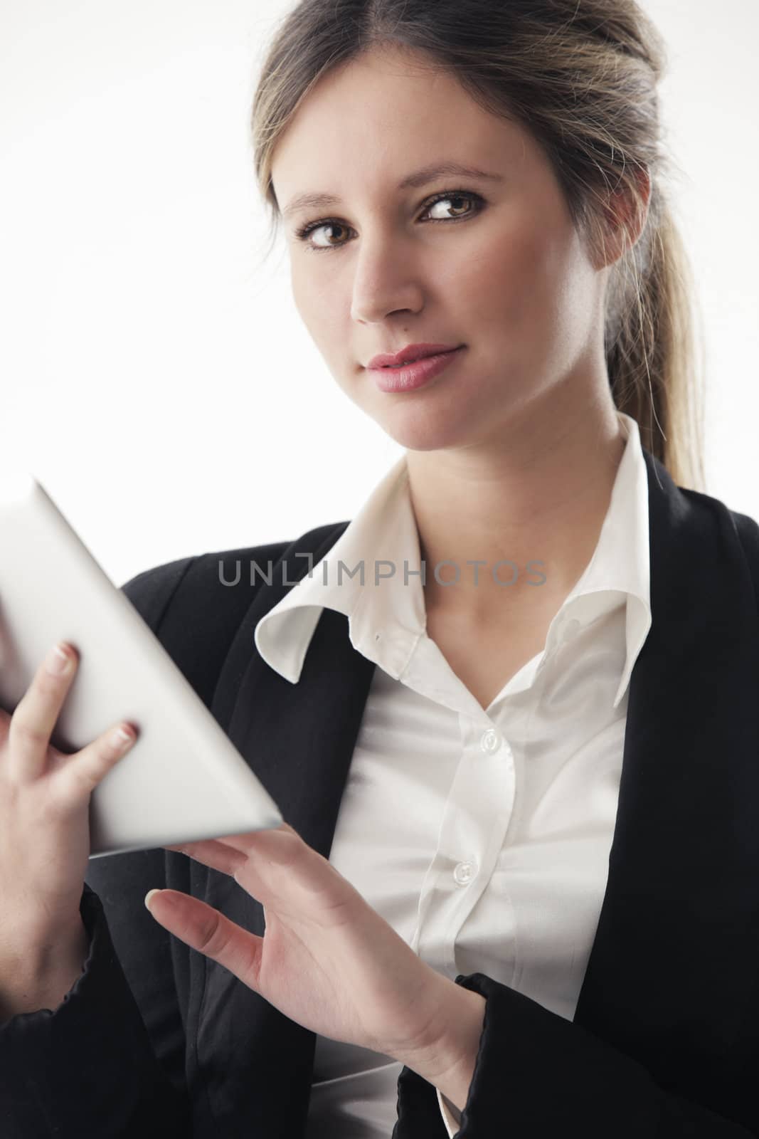 Portrait of young business woman working on digital tablet