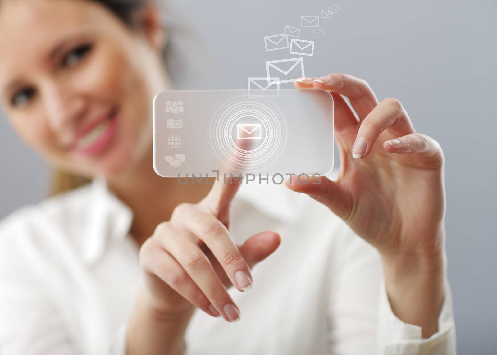 Beautiful woman is typing a mail on her innovative smartphone