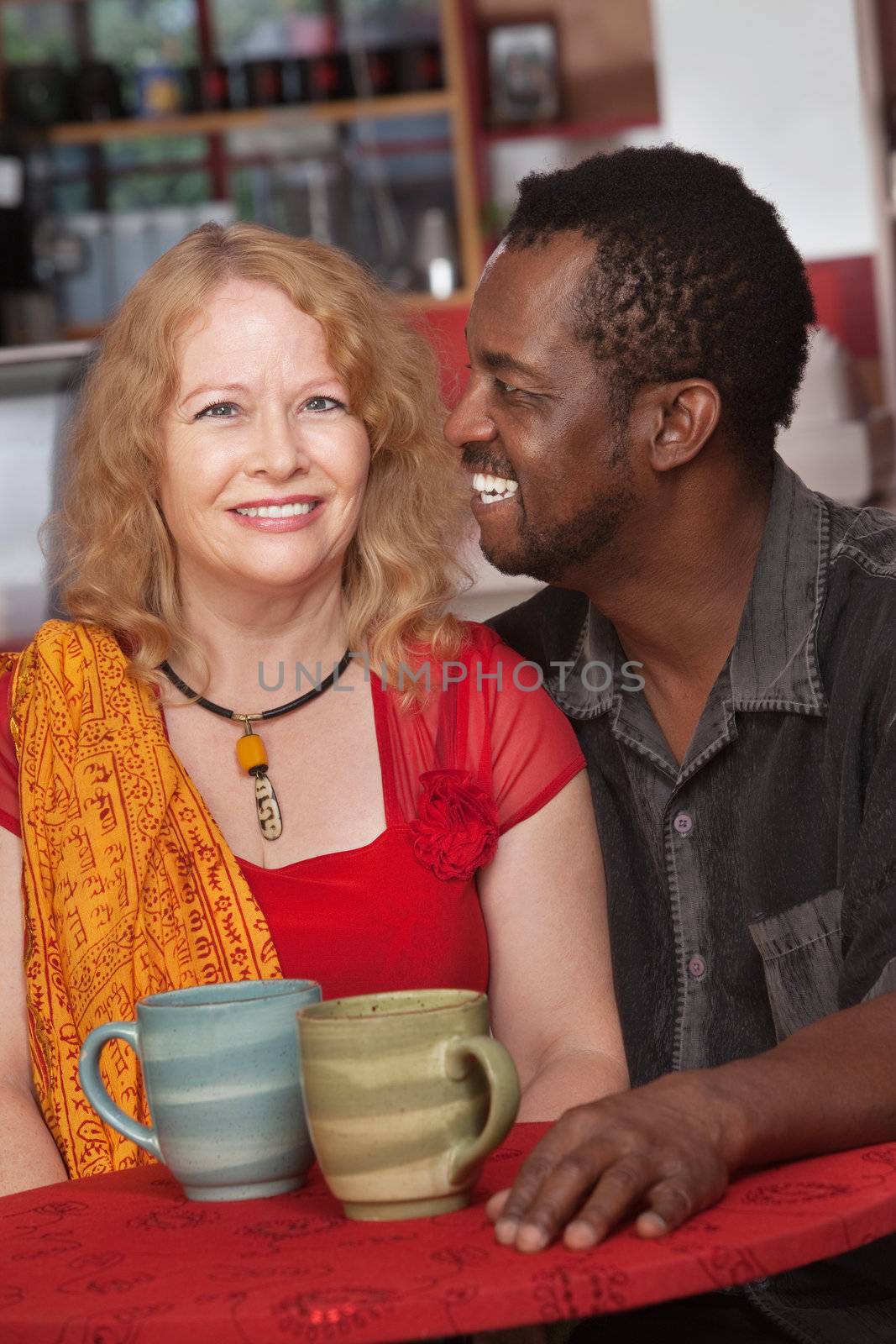 Attractive Black and white couple in restaurant