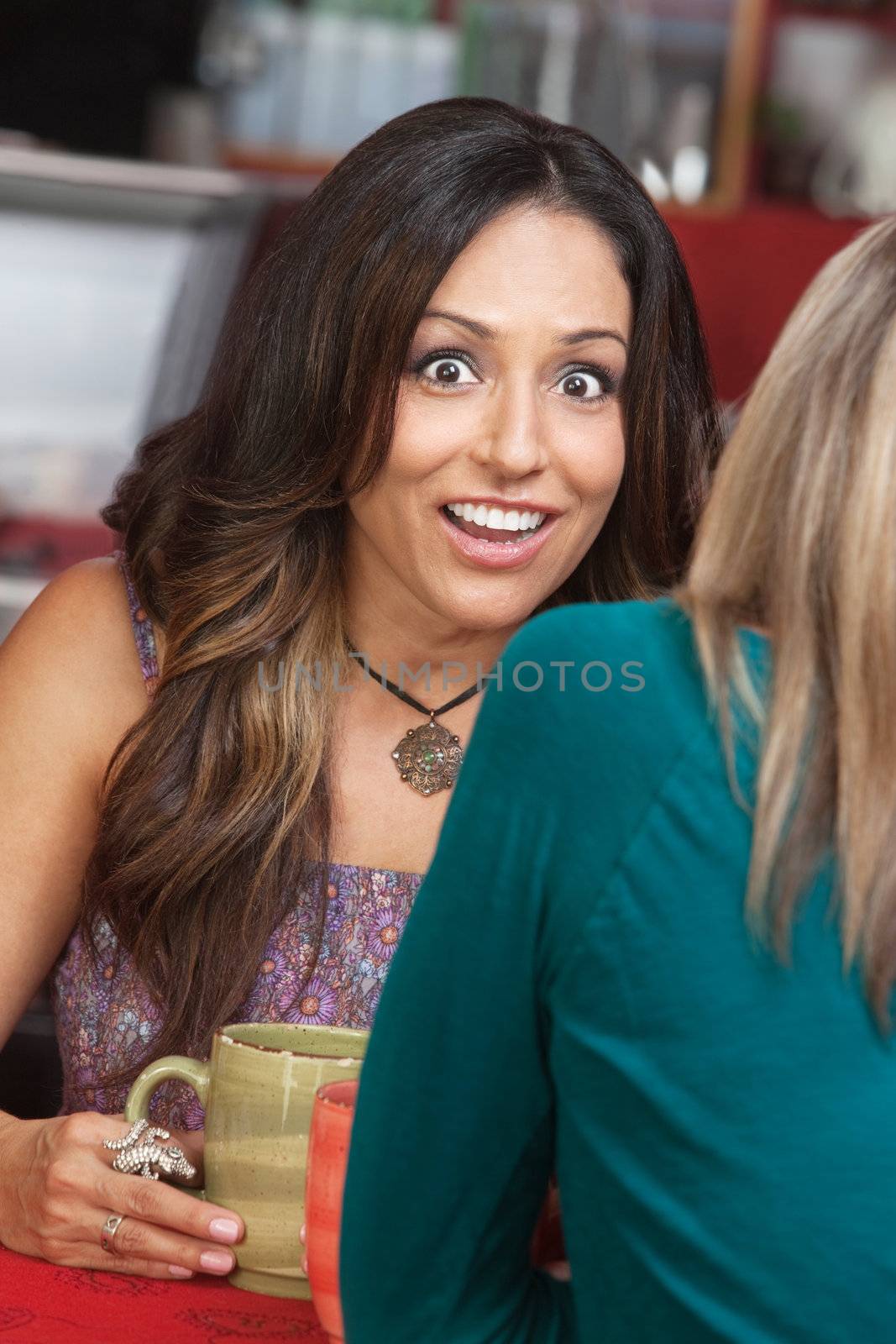 Shocked Woman with Smile in Cafe by Creatista