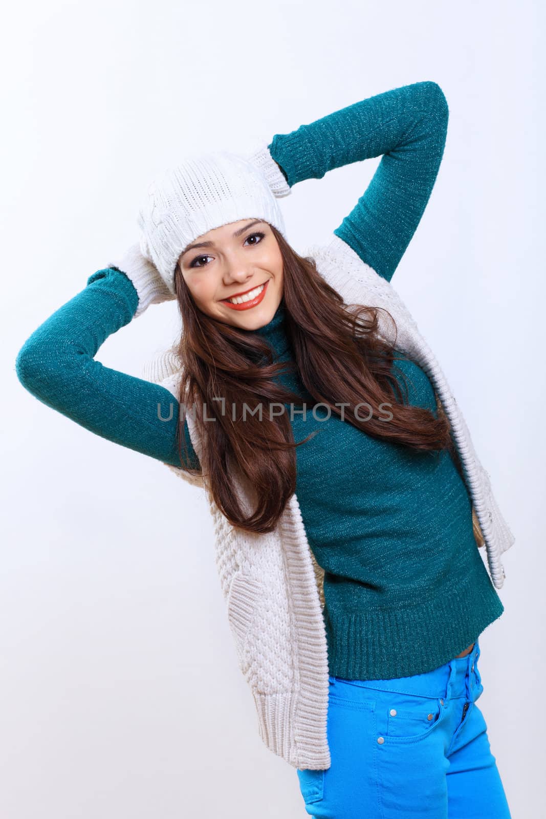 Young pretty woman with long hair wearing warm pullover
