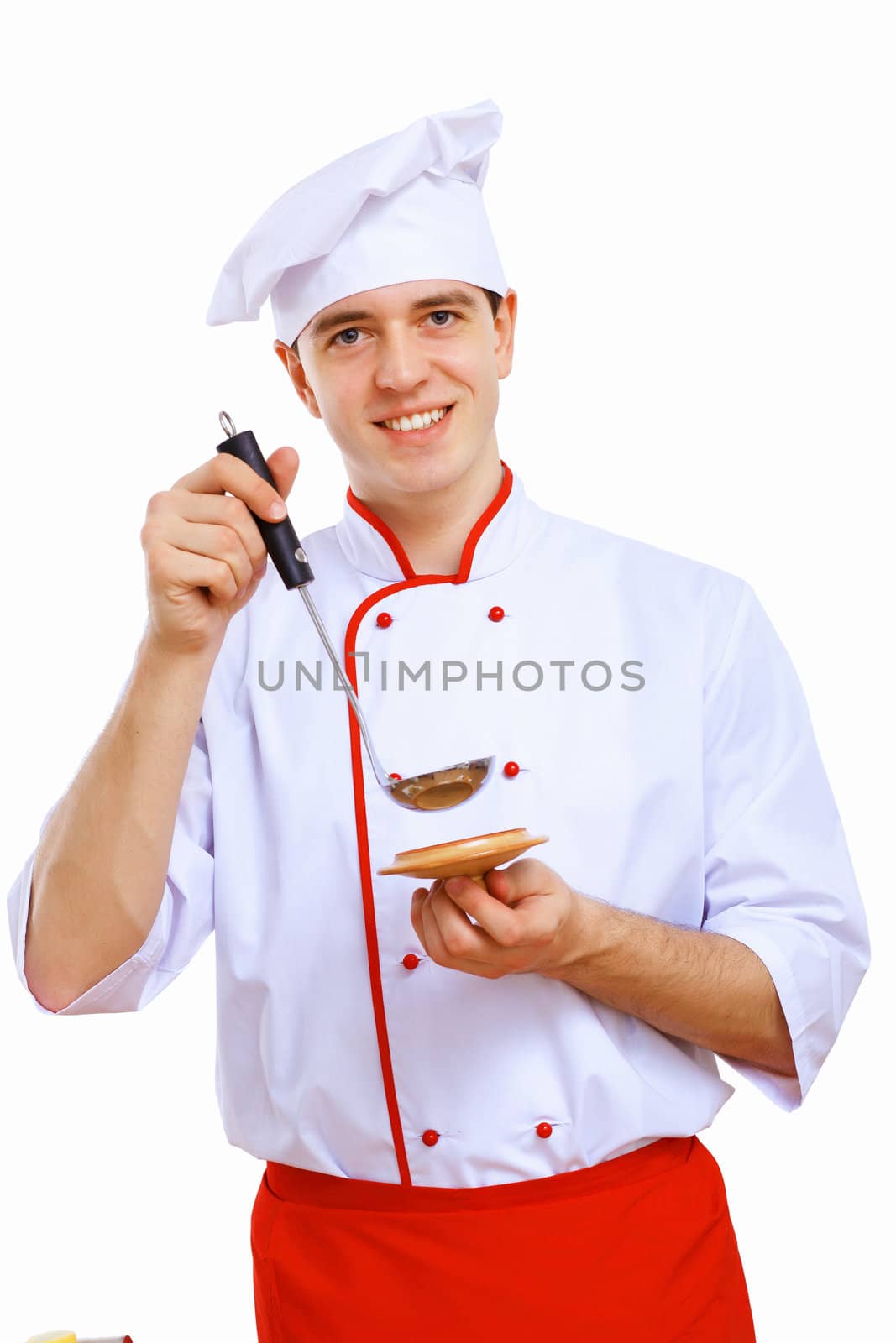 Young cook preparing food wearing a red apron