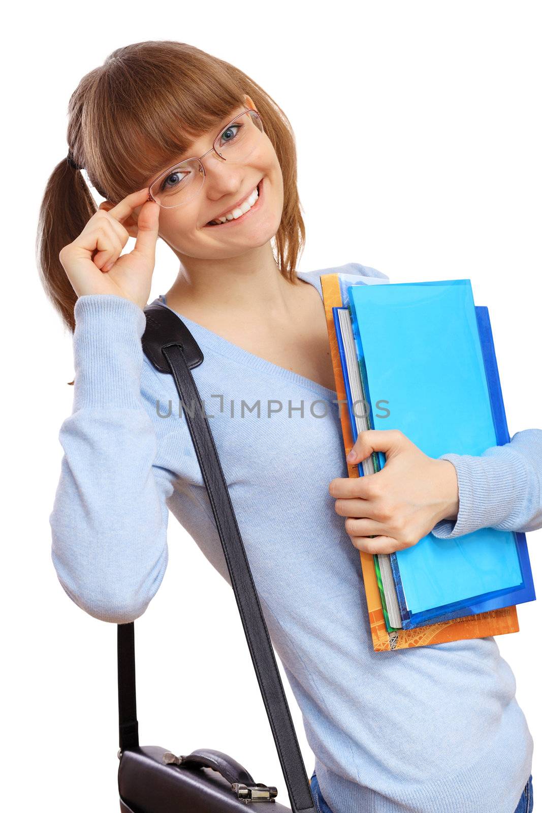 Happy smiling student standing and holding books