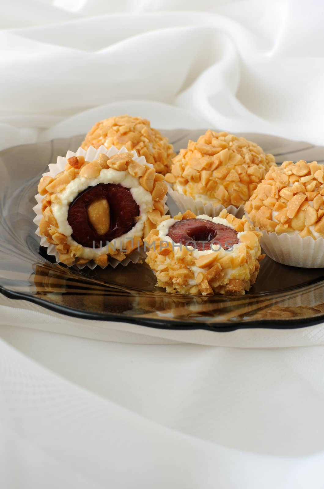 Cheese balls with cherries in peanuts by Apolonia