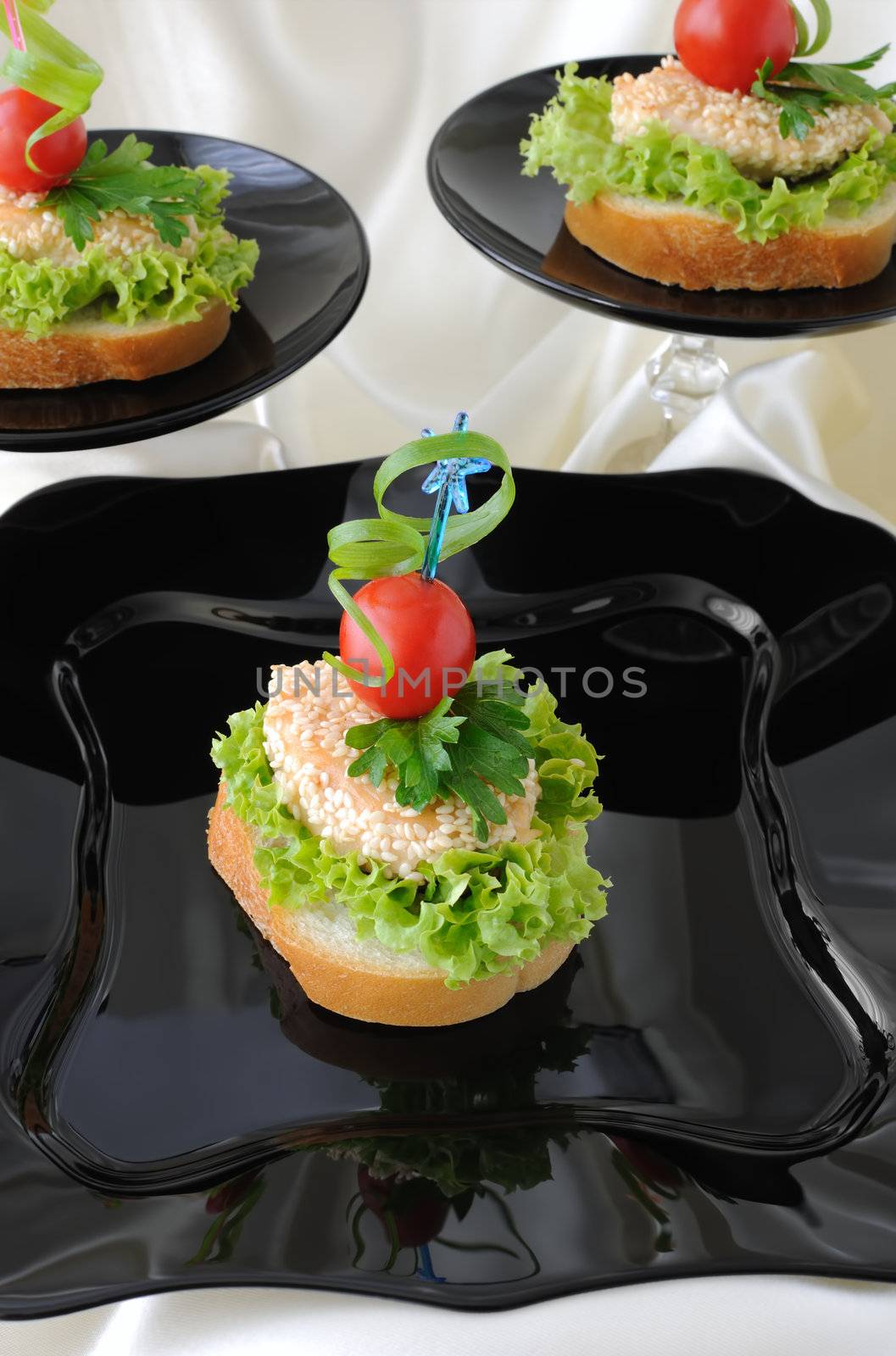 Mini sandwiches (canapés) with chicken in sesame