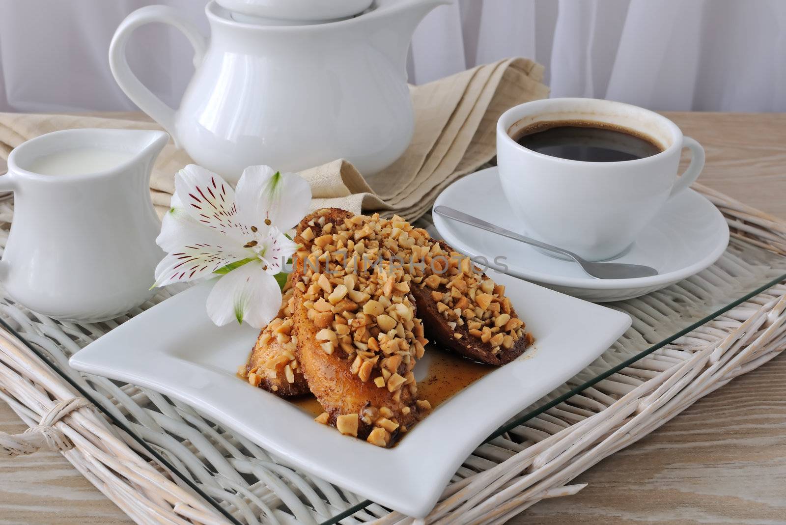 French toast with walnuts and cinnamon and a cup of coffee