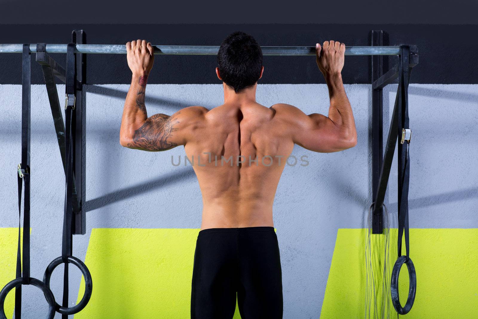 Crossfit toes to bar man pull-ups 2 bars workout exercise at gym
