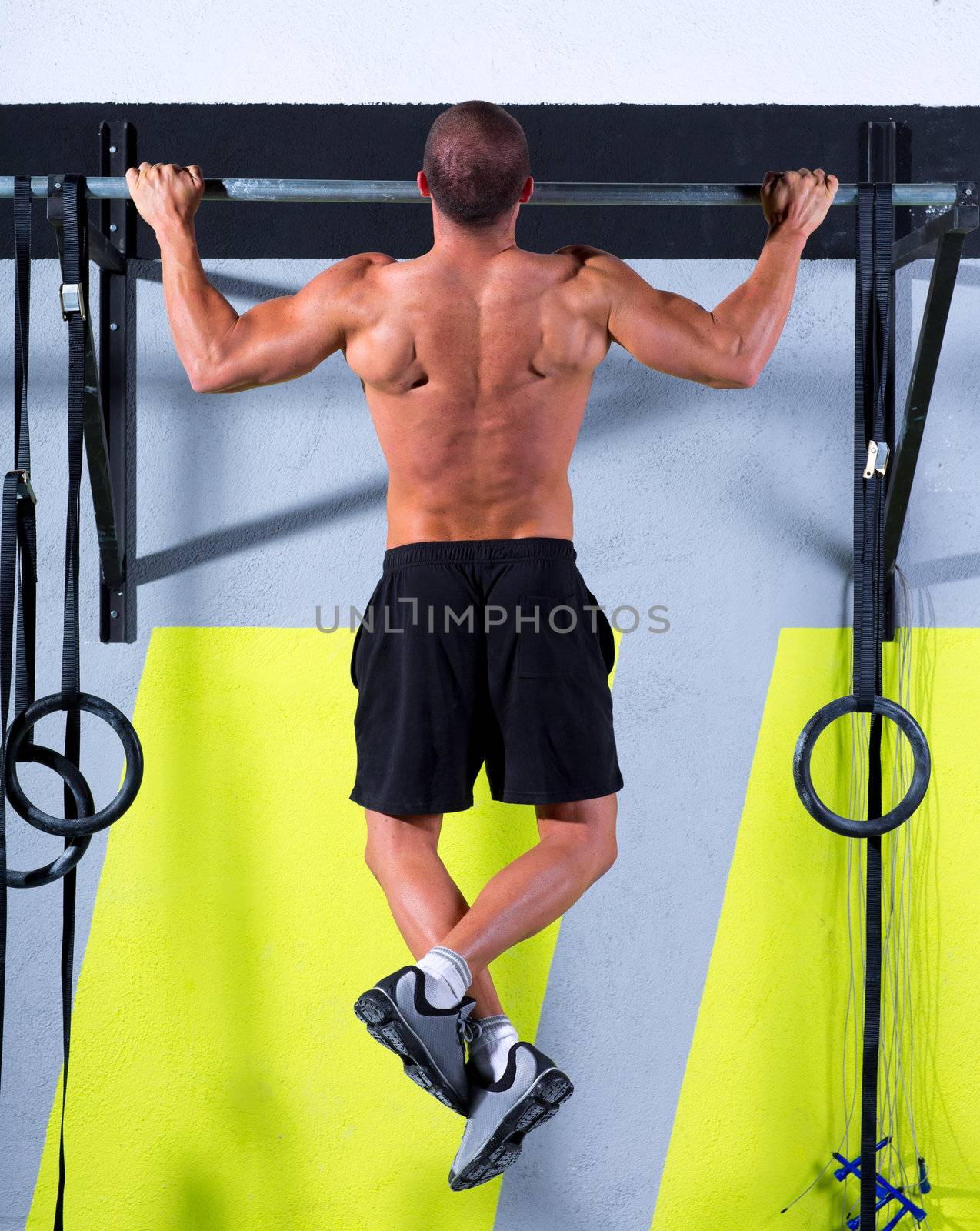 Crossfit toes to bar man pull-ups 2 bars workout exercise at gym