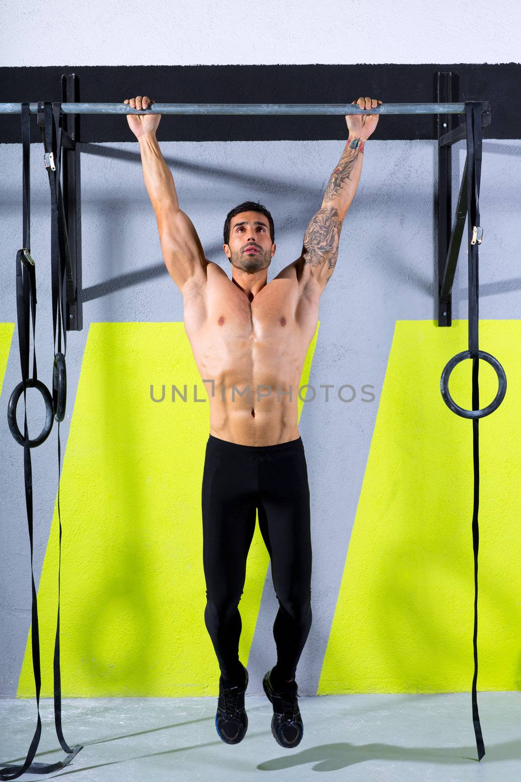 Crossfit toes to bar man pull-ups 2 bars workout exercise at gym