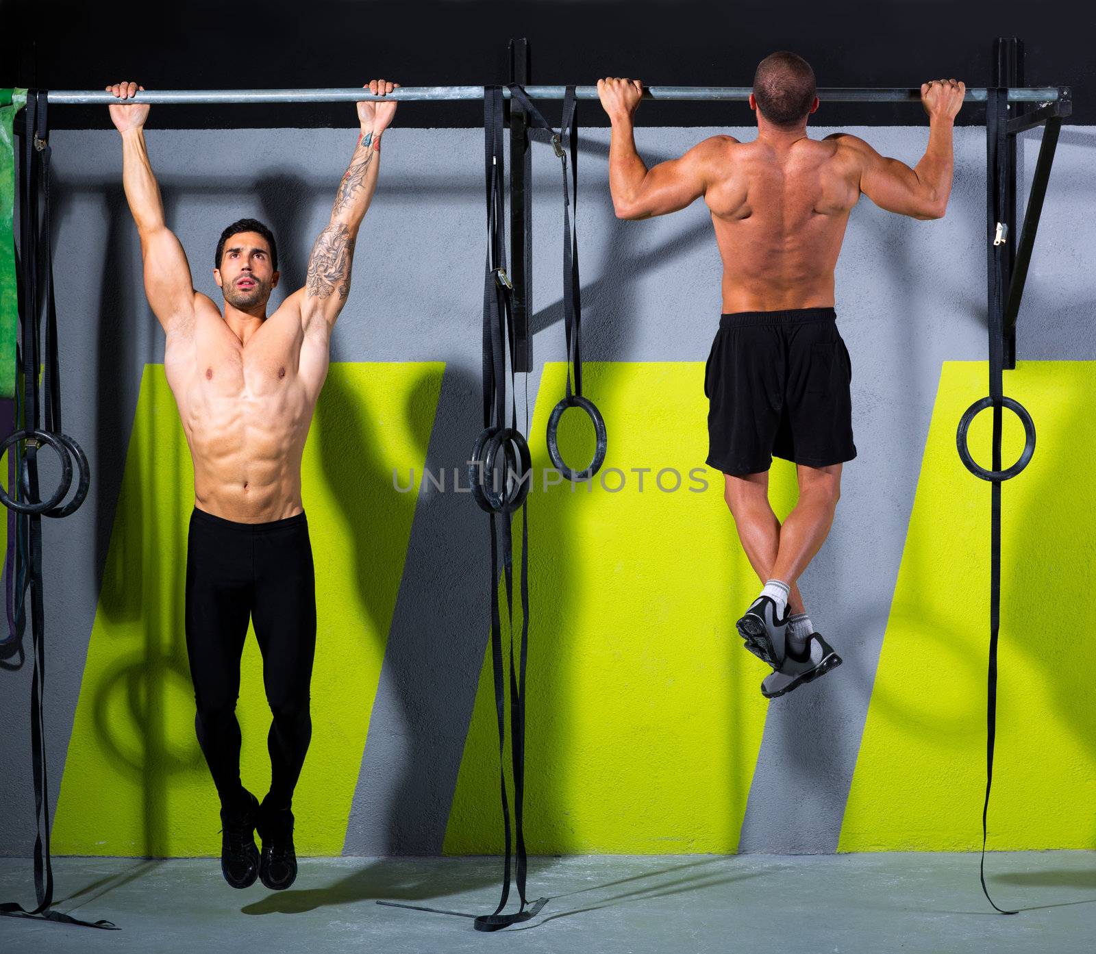 Crossfit toes to bar men pull-ups 2 bars workout exercise at gym