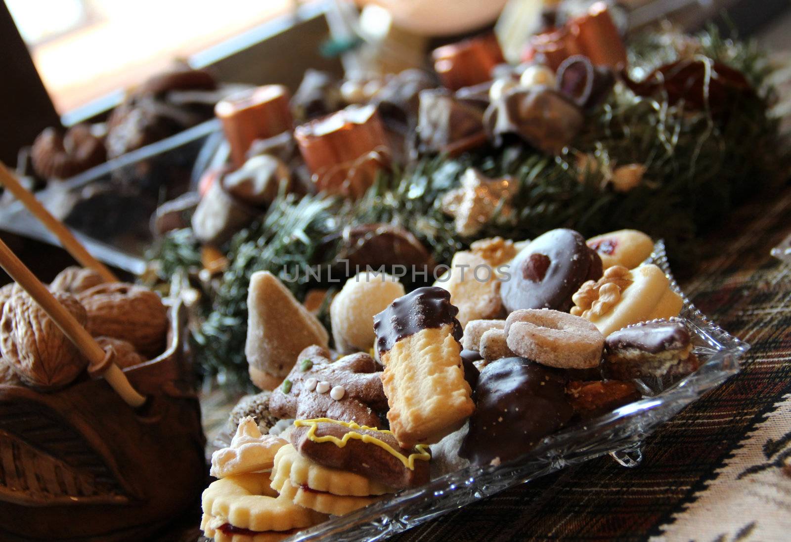 Wreath and mix of homemade sweets on the Christmas table