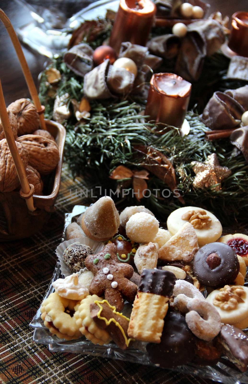 Wreath and mix of homemade sweets on the Christmas table