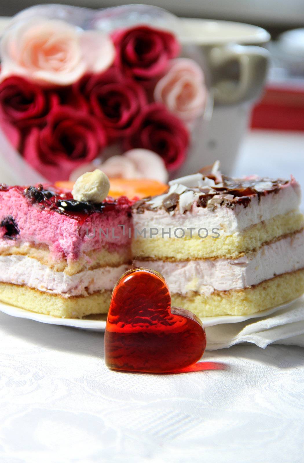 Valentine's Day decoration, roses, cake and glass heart 