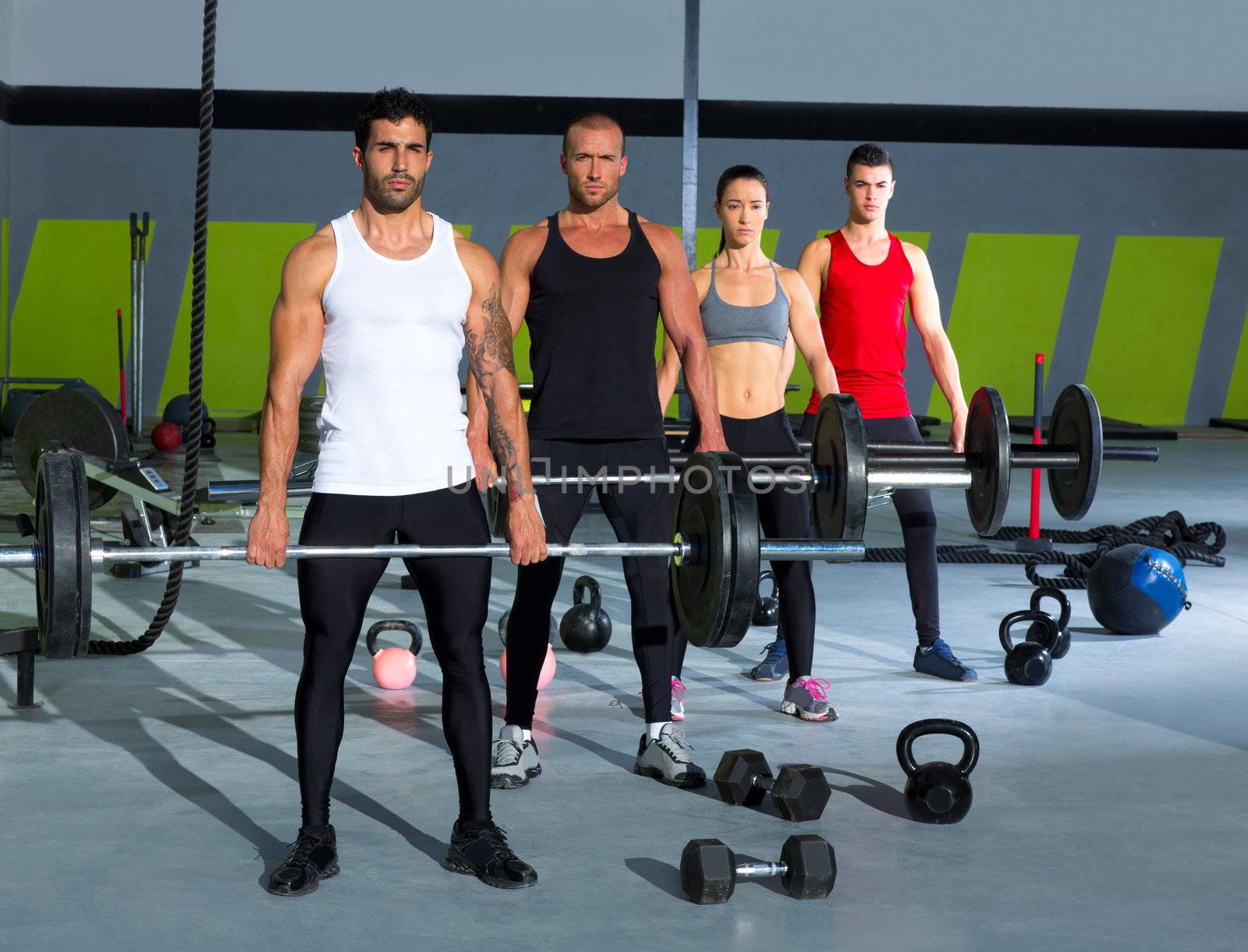 gym group with weight lifting bar workout in crossfit exercise