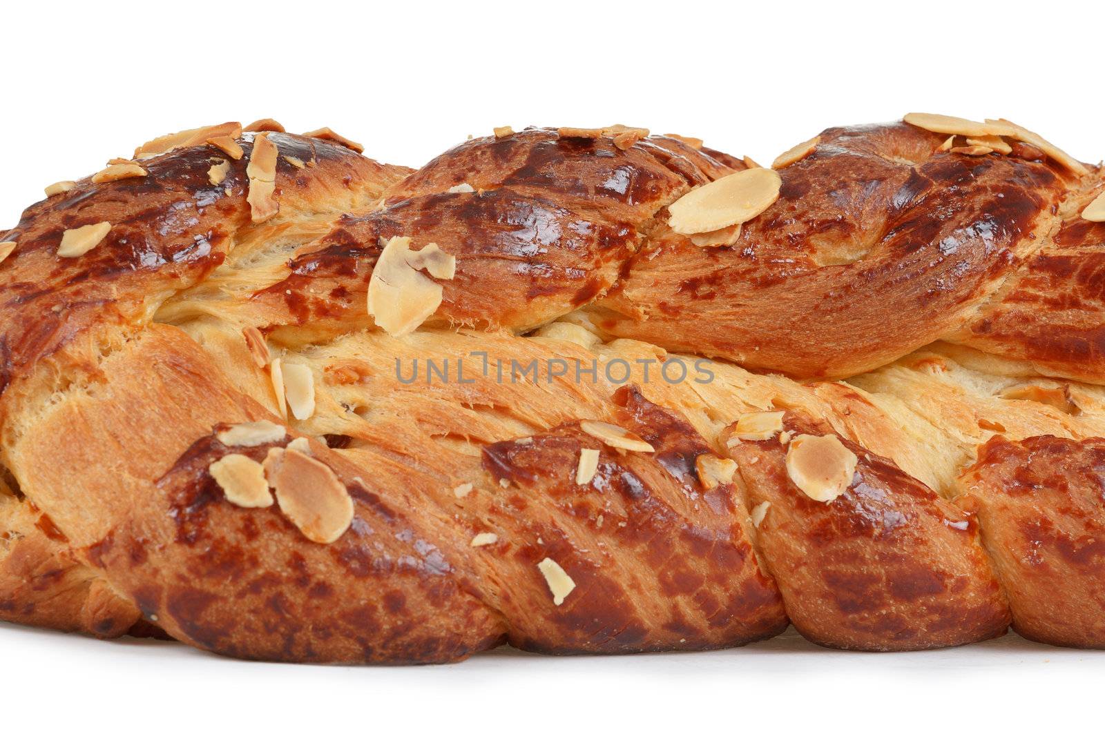 detail of christmas cake with almonds on white background