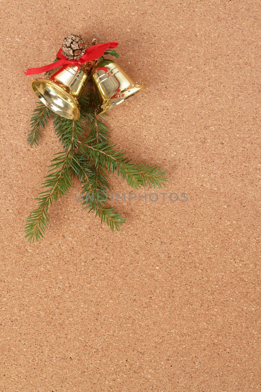 corkboard with christmas bels and needles decorations for santa message