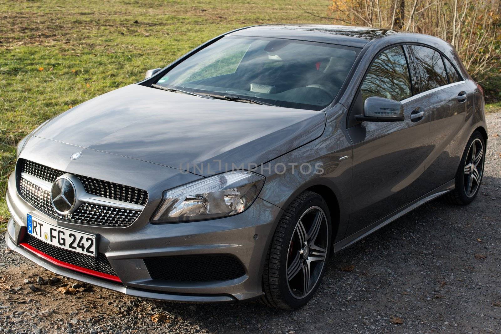STUTTGART - NOVEMBER 21 : The new Mercedes Class A 250 AMG Sport is parked in front of Solitude Palace on November 21, 2012 in Stuttgart, Germany. The new A-Class is a complete makeover of the previous generations, the 250 AMG Sport is the largest version available, developed together with car tuner AMG.
