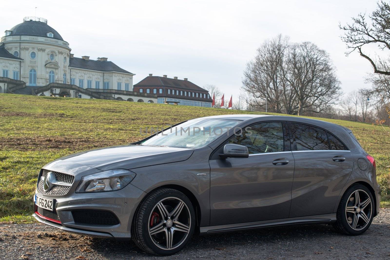 STUTTGART - NOVEMBER 21 : The new Mercedes Class A 250 AMG Sport is parked in front of Solitude Palace on November 21, 2012 in Stuttgart, Germany. The new A-Class is a complete makeover of the previous generations, the 250 AMG Sport is the largest version available, developed together with car tuner AMG.