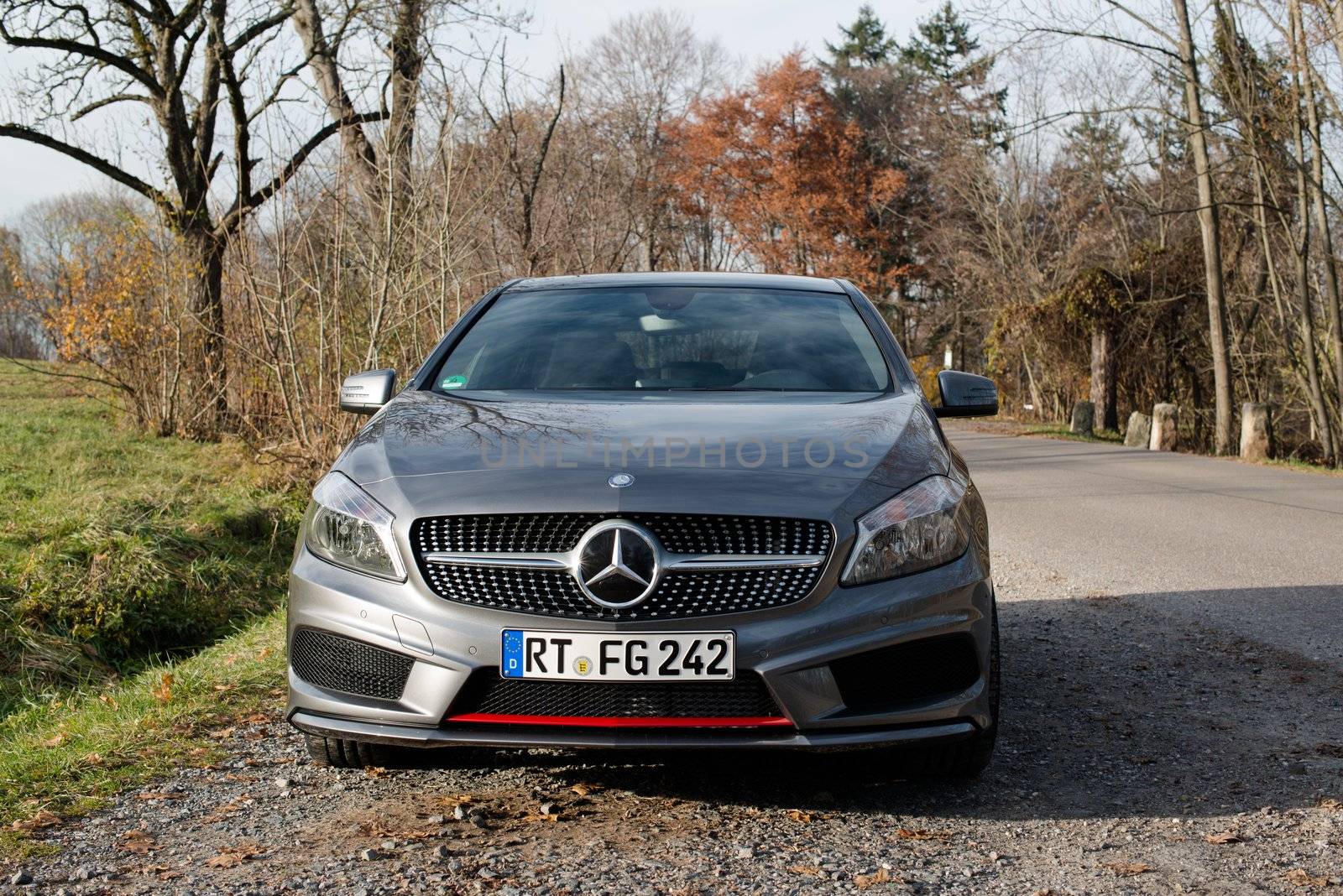 STUTTGART - NOVEMBER 21 : The new Mercedes Class A 250 AMG Sport is parked in front of Solitude Palace on November 21, 2012 in Stuttgart, Germany. The new A-Class is a complete makeover of the previous generations, the 250 AMG Sport is the largest version available, developed together with car tuner AMG.