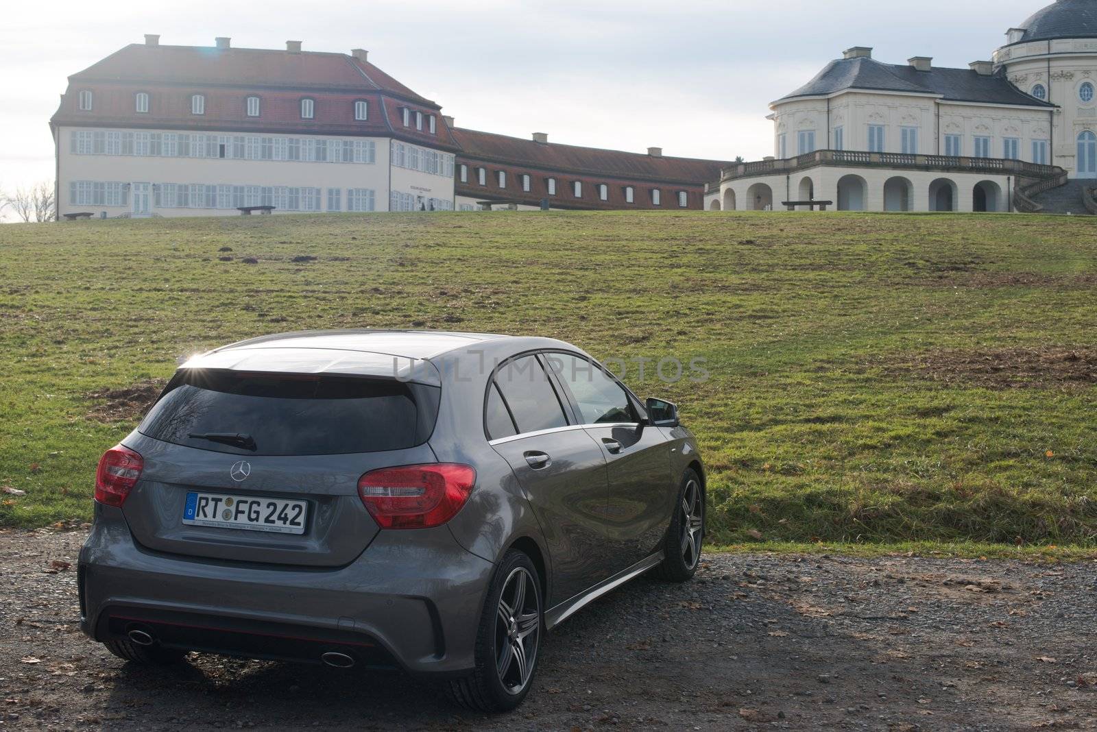 STUTTGART - NOVEMBER 21 : The new Mercedes Class A 250 AMG Sport is parked in front of Solitude Palace on November 21, 2012 in Stuttgart, Germany. The new A-Class is a complete makeover of the previous generations, the 250 AMG Sport is the largest version available, developed together with car tuner AMG.