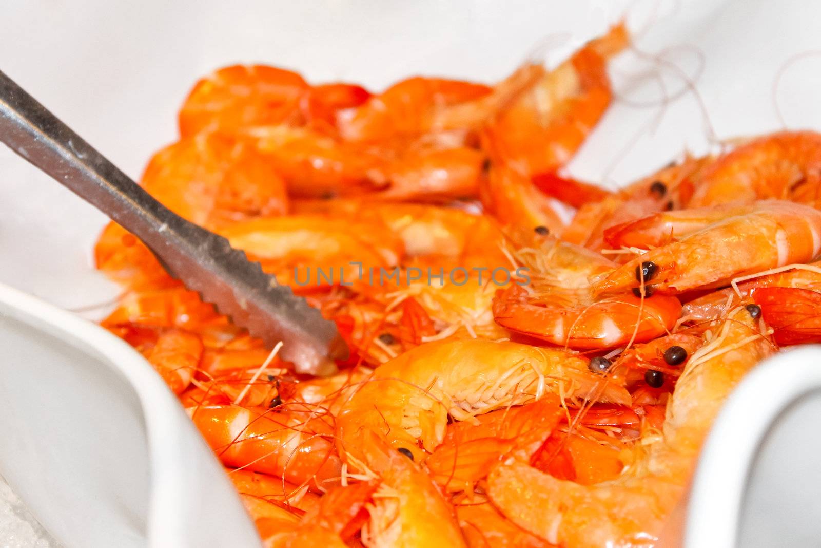 Boiled shrimp in a bowl in a restaurant by NickNick