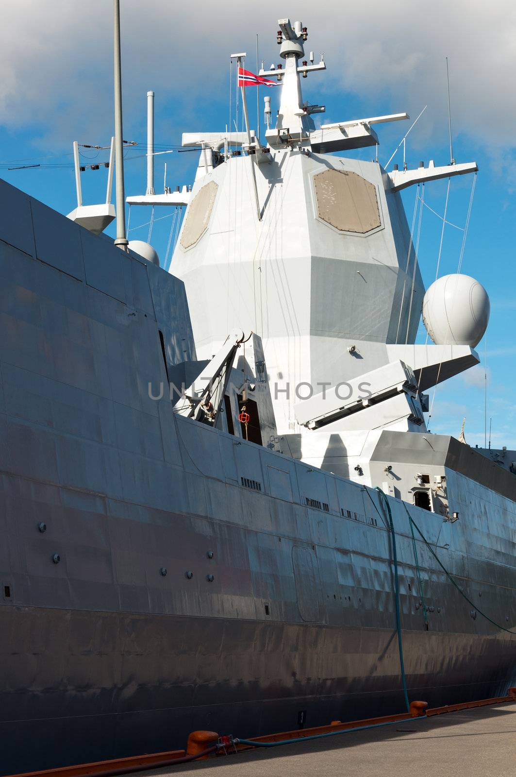 Military ship with radar system at the pier