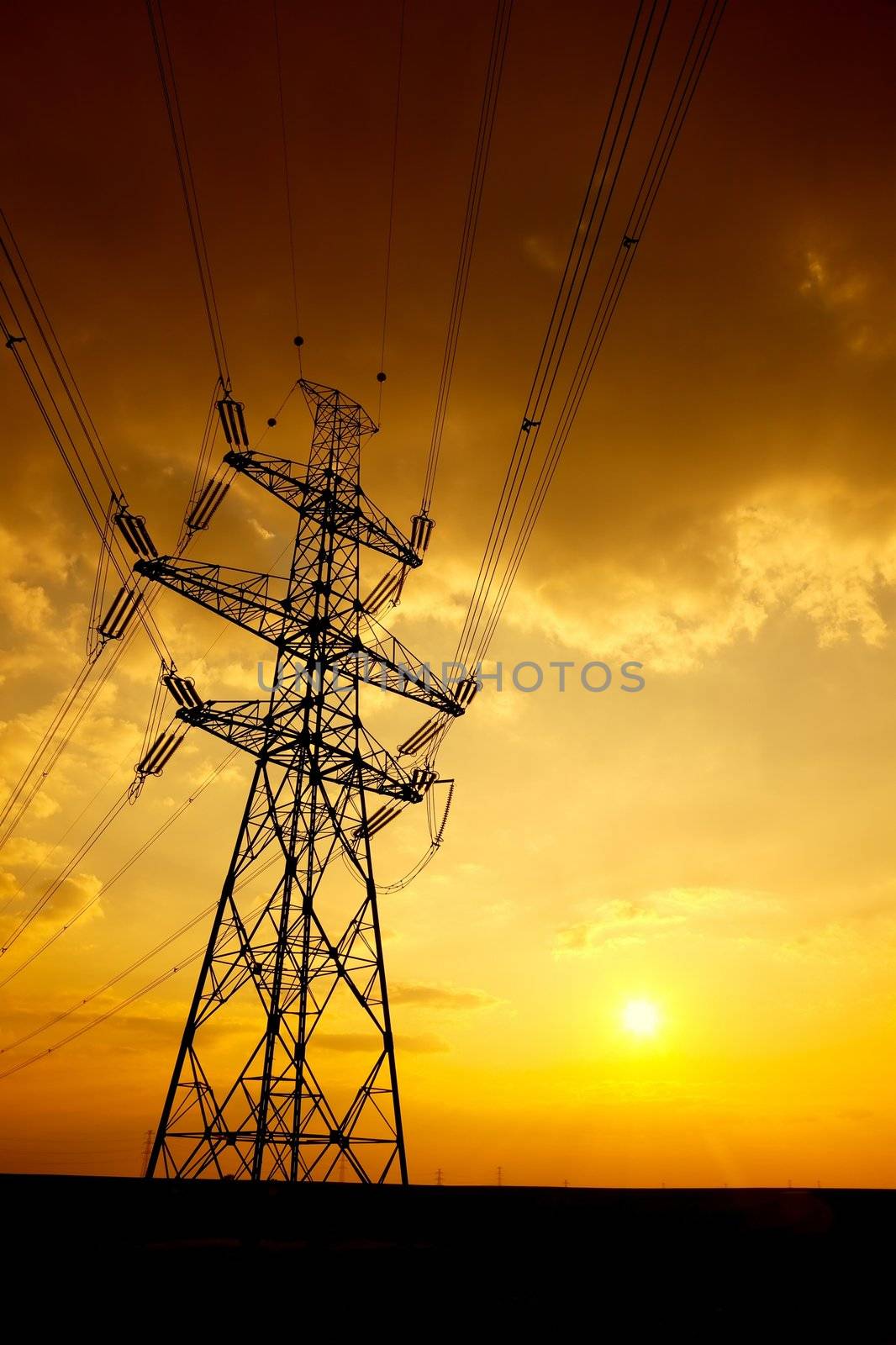 High voltage electric tower in the sunset