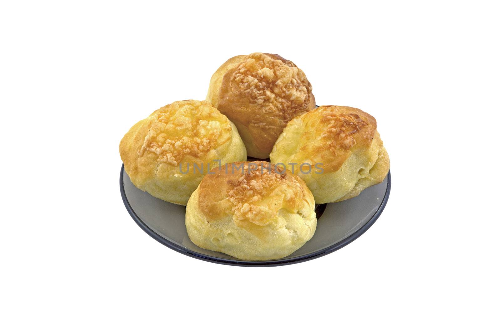 Four scones on a glass plate on white background
