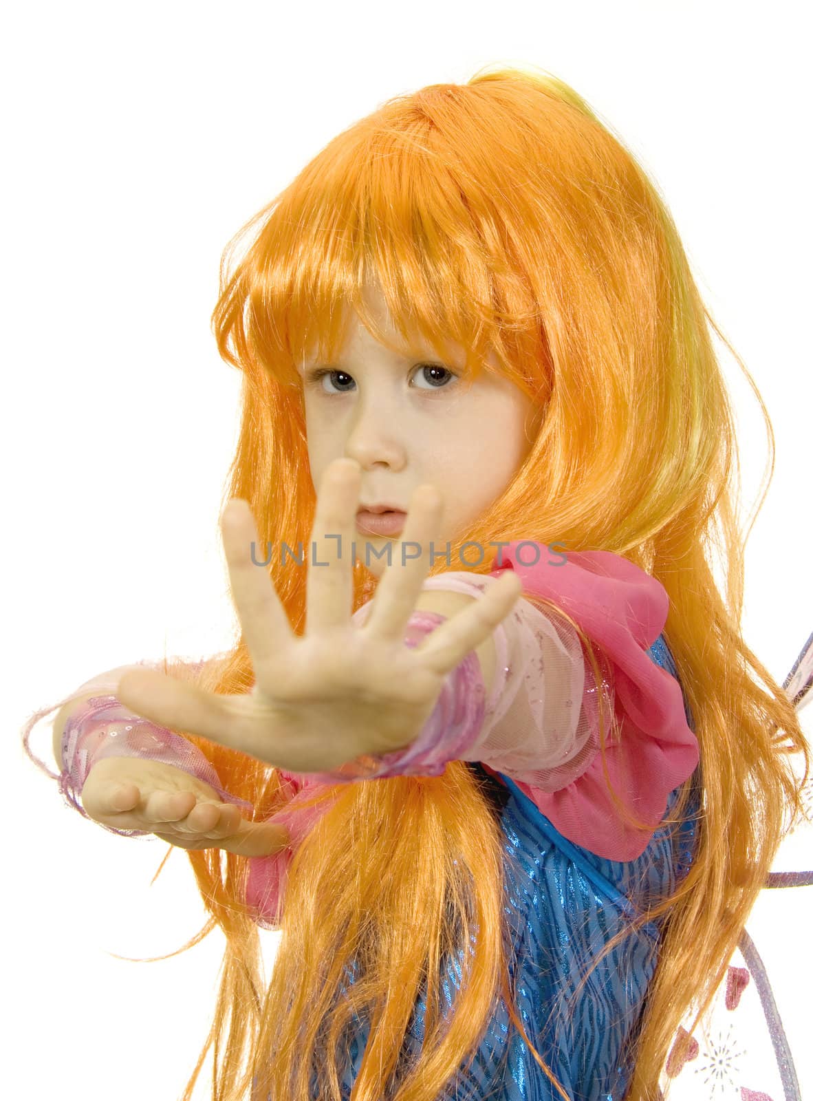 Girl in fancy dress and a wig on a white background