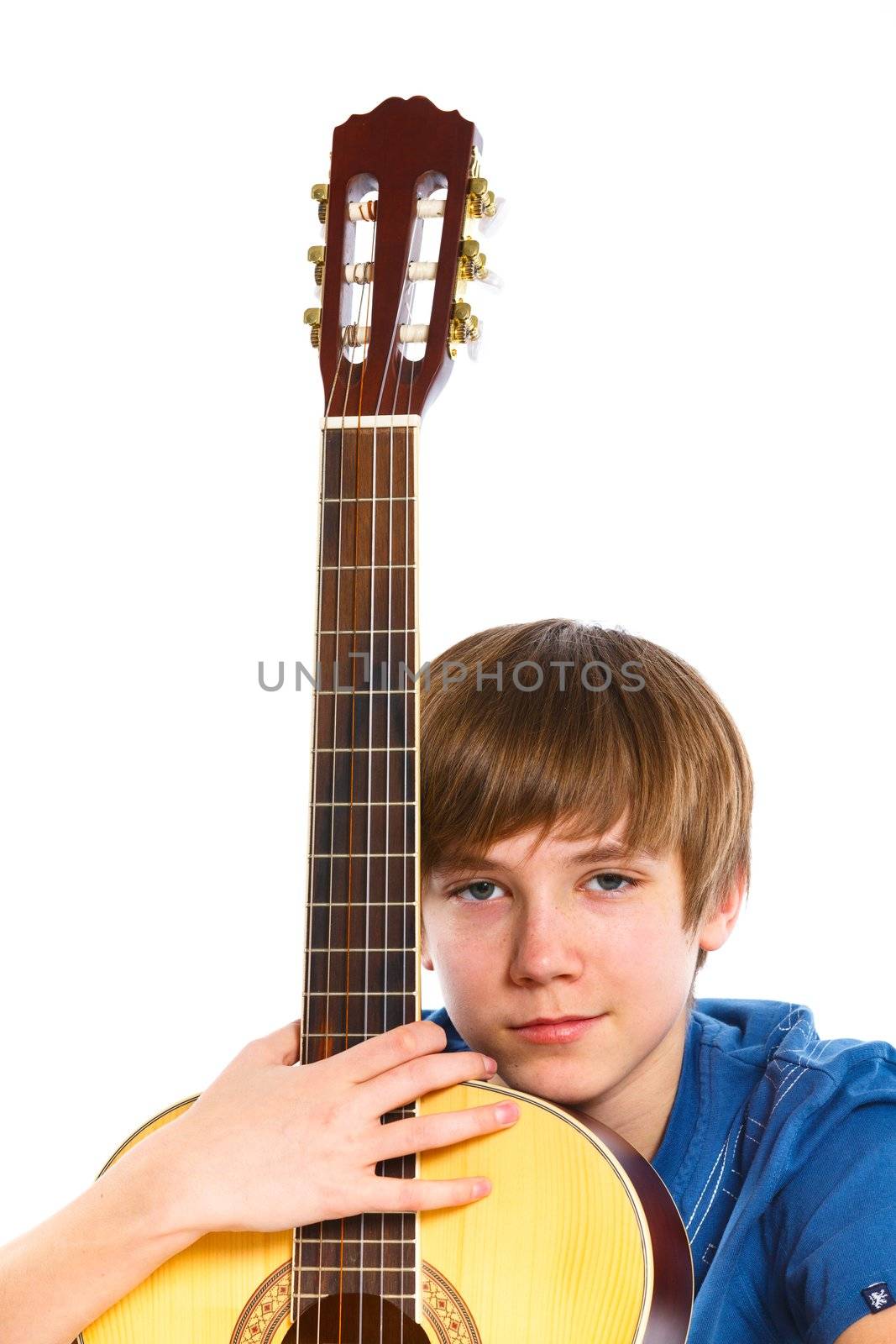 Portrait of cute boy with classical guitar. Isolated on white background