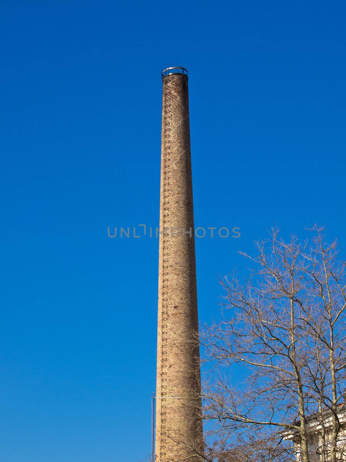 old factory chimney made of red bricks