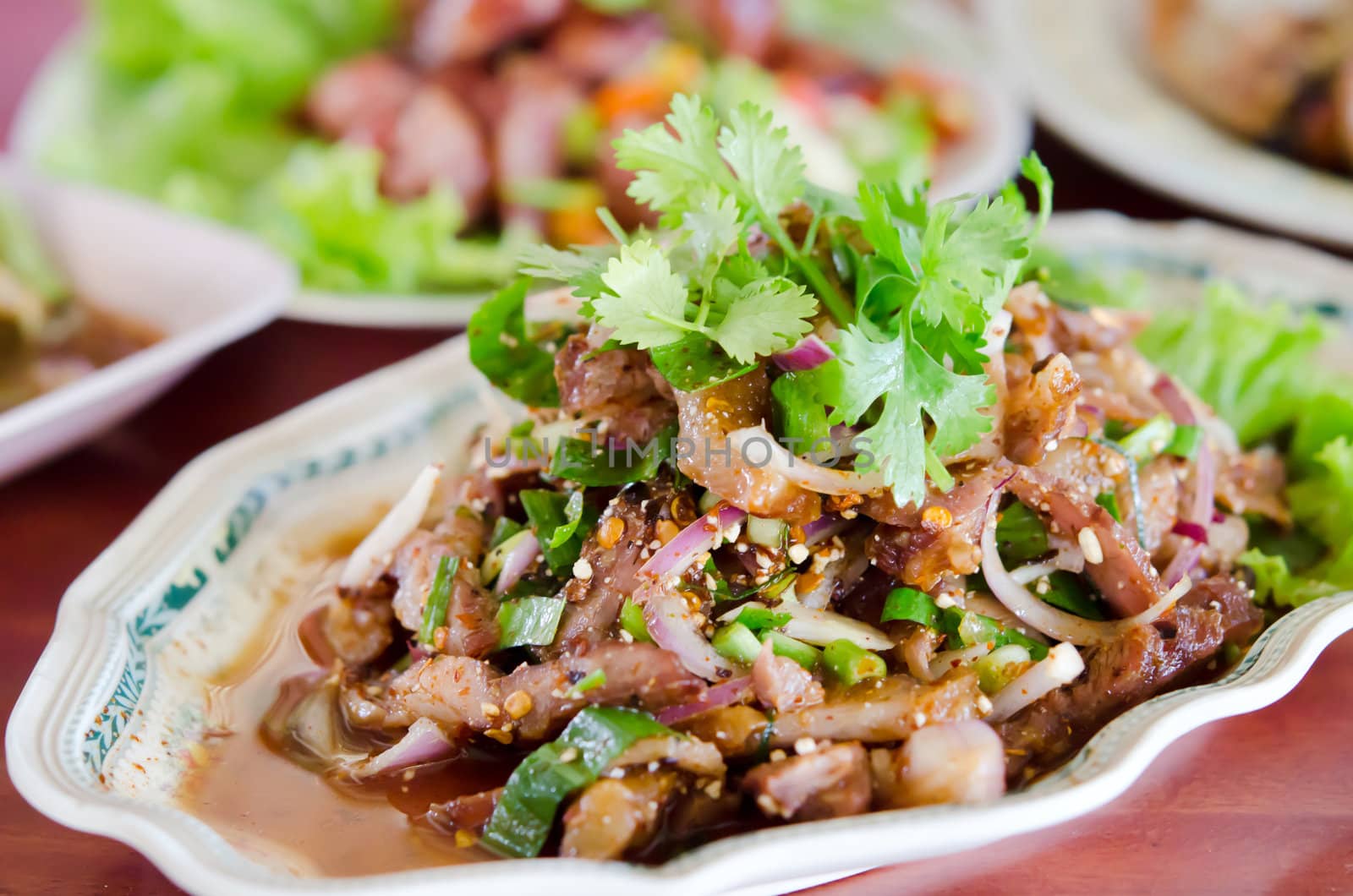 spicy slices pork  with mix vegetable on dish