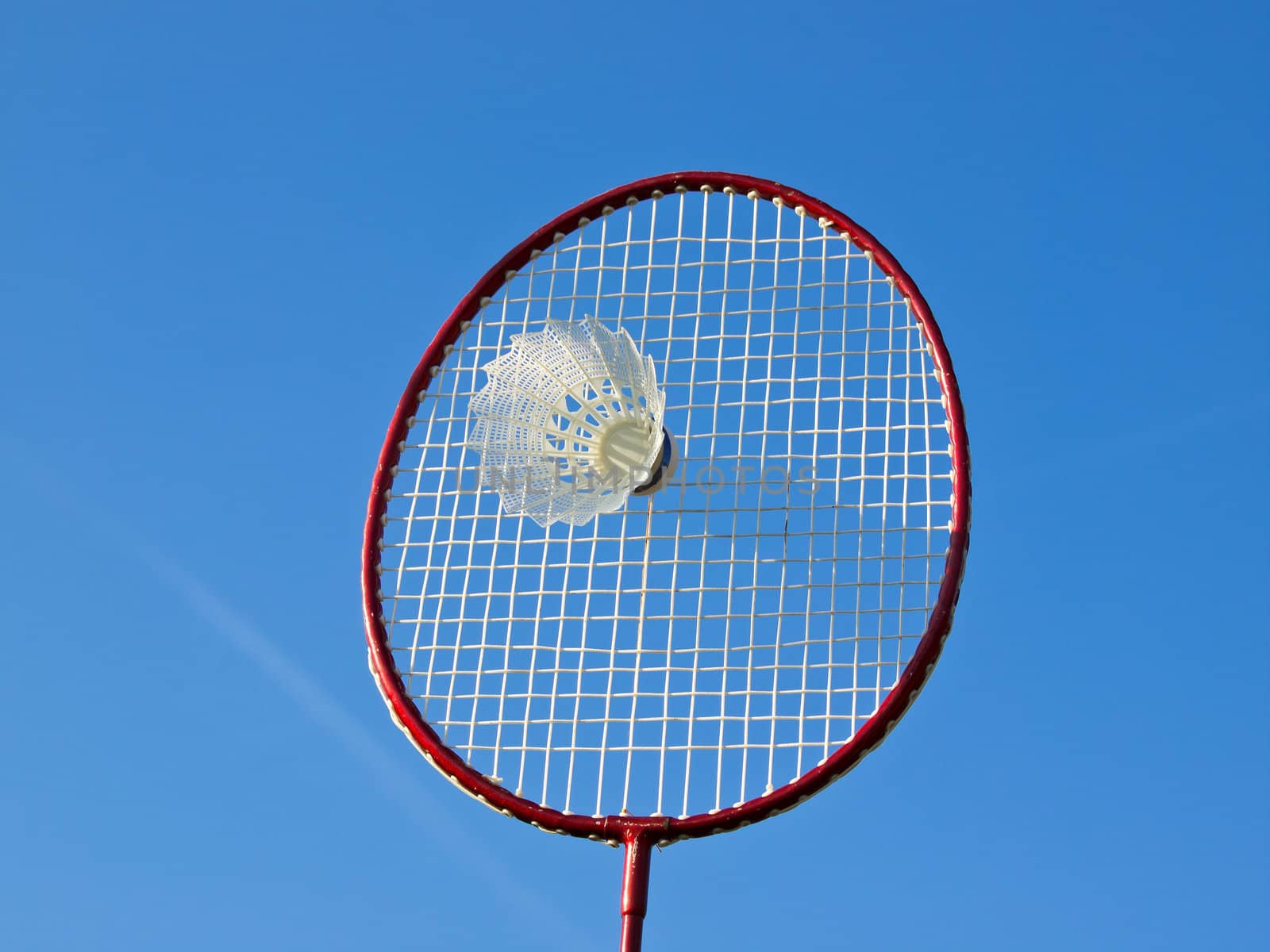 badminton racket and ball under the blue sky