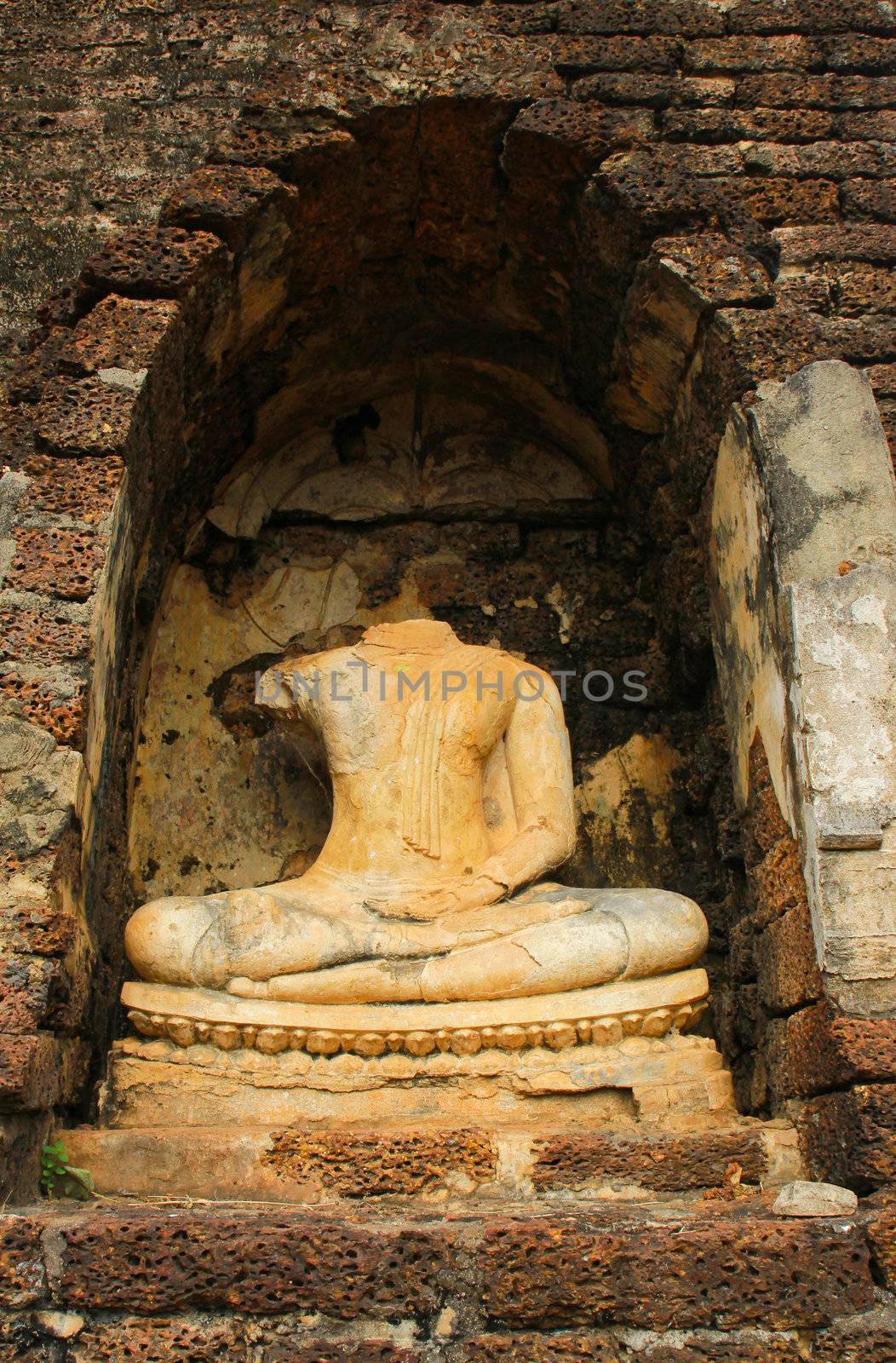 Sculpture of ruin buddha in Sukhothai, Thailand  by nuchylee
