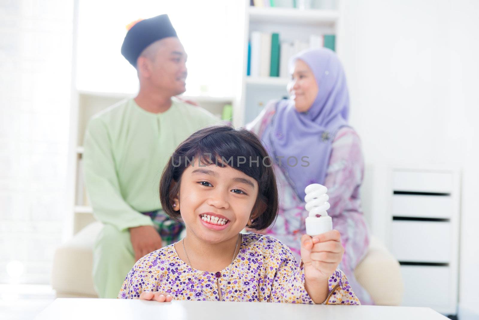 Muslim Southeast Asian girl lightbulb idea concept.