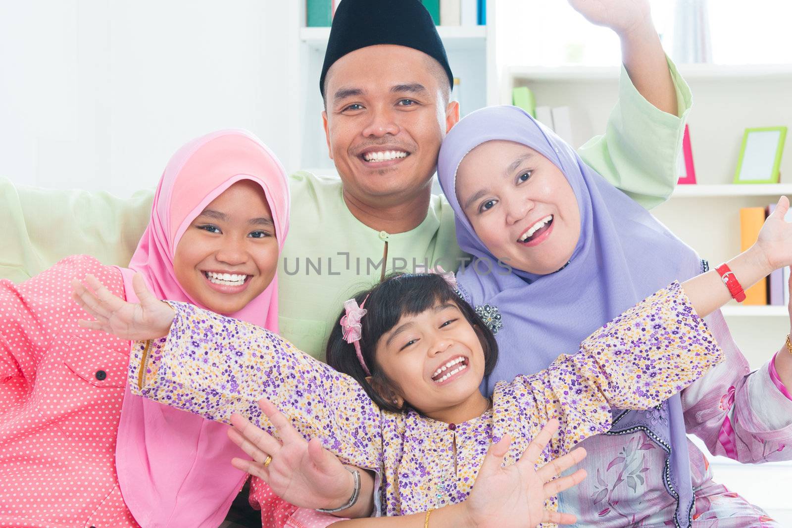 Southeast Asian family quality time at home. Muslim family living lifestyle.