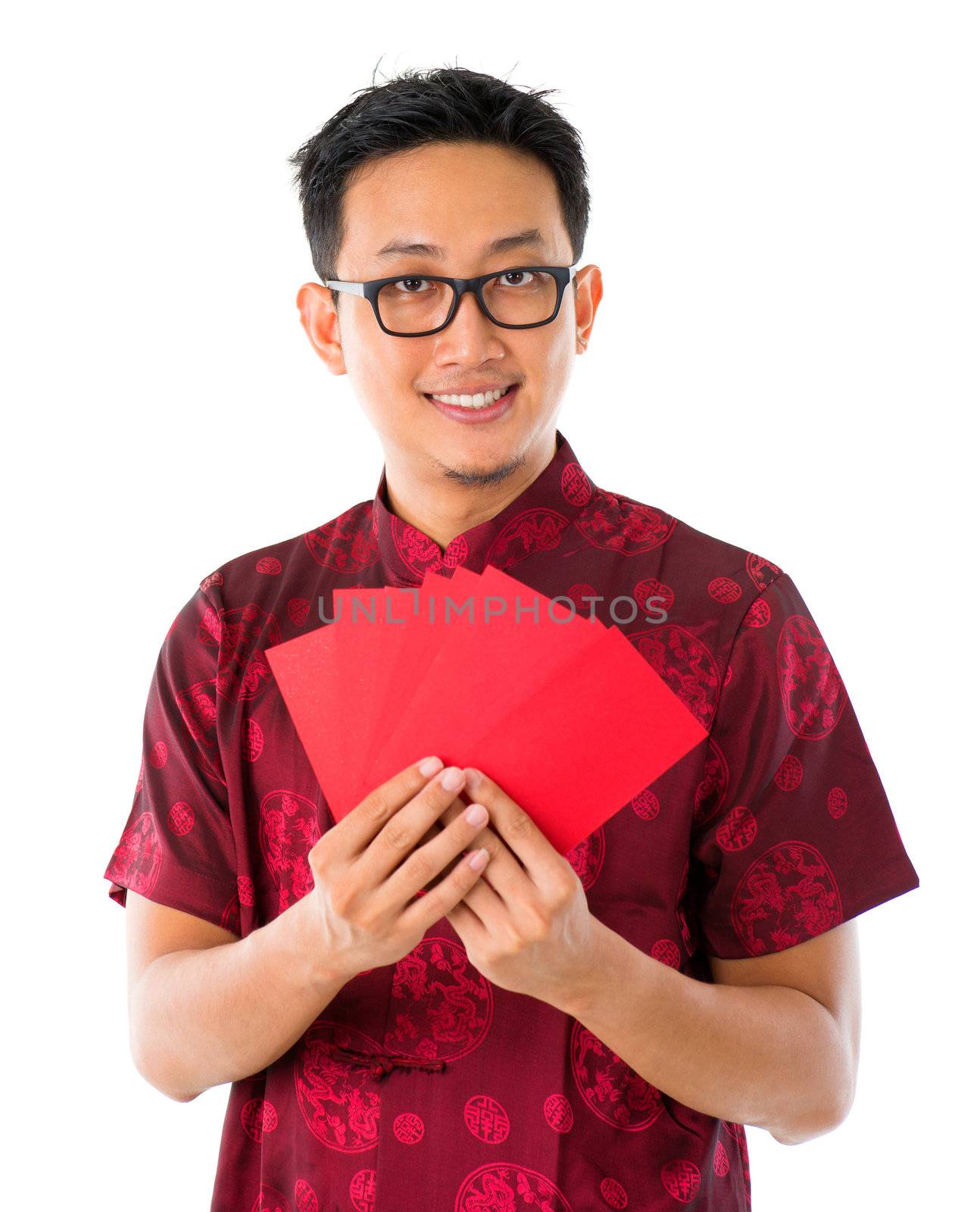 Asian Chinese man holding red packets / ang pow for happy chinese new year, isolated over white background