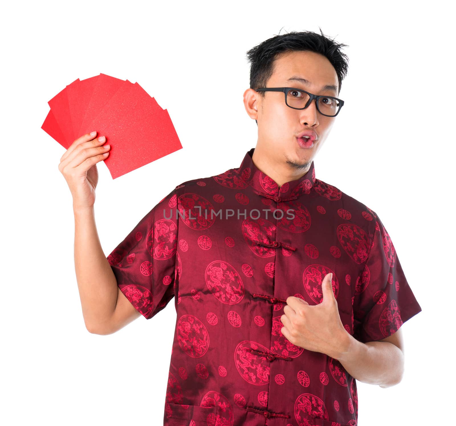 Shocked Asian Chinese man holding many red packets / ang pow for happy chinese new year, isolated over white background